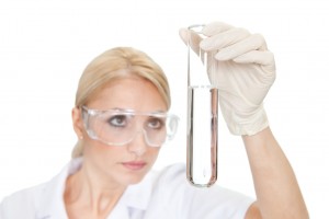 Researcher looking into liquid